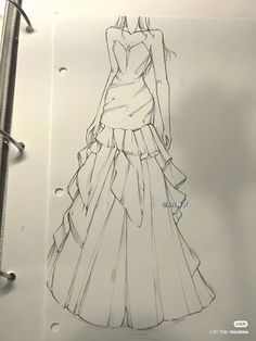 a drawing of a dress on top of a piece of paper