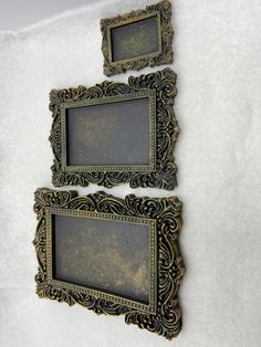 two old fashioned frames are hanging on the wall