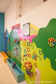 a brightly colored wall in a children's playroom