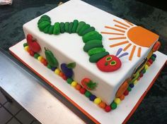 the very hungry caterpillar birthday cake is ready to be cut and served for guests