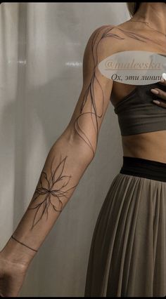 a woman with a tattoo on her arm