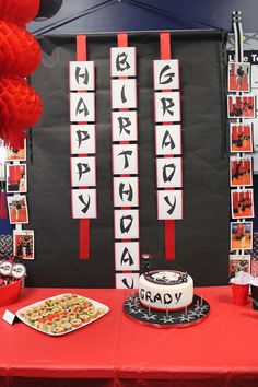 a red table topped with a cake and dessert