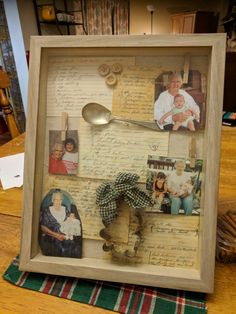 a wooden frame with pictures and spoon in it