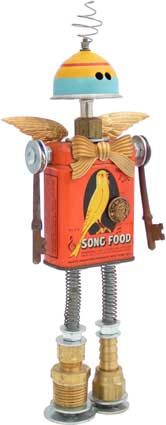 a toy robot that is standing next to some keys and nuts on it's head