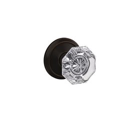 an image of a door knob in chrome or black with clear glass on the front