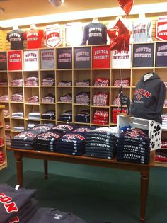 shirts and hats are on display in a store