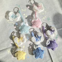 several crocheted keychains are arranged on a table