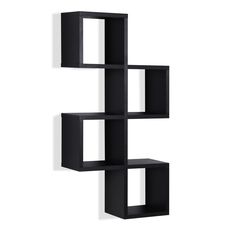 a black shelf with three cubes on the bottom and one in the middle, against a white wall