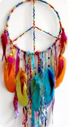 a peace sign made out of colorful feathers