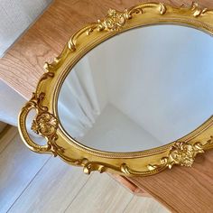 a mirror that is sitting on top of a table