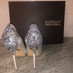 Brand New. Worn Once For A Couple Minutes While Trying On Gown, Perfect Condition. Absolutely Stunning Shoe, Satin Material. Leather Sole, Heel Measures 4.5”. Platform Measures 1 Inch, Peep Toe Platform Pump Featuring Dramatic Cluster Of Sparkling Rhinestones At Heel. Comes With Box And Bag It Was Purchased In. Elegant Bedazzled Heels With Round Toe, Elegant Bedazzled Round Toe Heels, Elegant Bedazzled Heels For Wedding, Elegant Bedazzled Closed Toe Heels, Elegant Embellished Wedding Shoes For Cocktail, Designer Silver Wedding Heels, Luxury Almond Toe Wedding Shoes, Elegant Bedazzled Wedding Shoes For Party, Embellished Formal Wedding Shoes