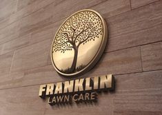 the franklin lawn care logo is shown on a building's exterior wall, which features a tree