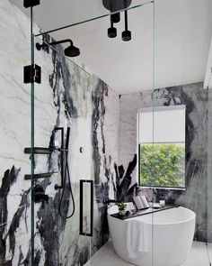 a bath room with a large tub and a window