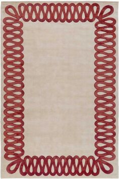 a white rug with red spirals on it