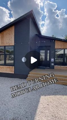 the front of a building with stairs leading up to it and an open door that says head turning modular home