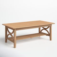 a wooden table sitting on top of a white floor