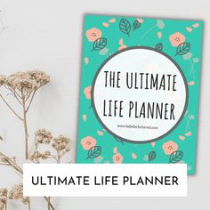 the ultimate life planner with flowers on it