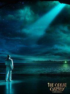 a man standing on top of a beach under a sky filled with stars and clouds