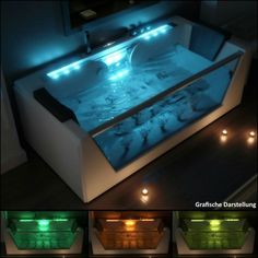 a bath tub filled with lots of water and lit up in different colors, sitting on top of a wooden floor