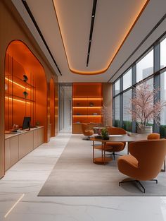 an office lobby with orange and white furniture