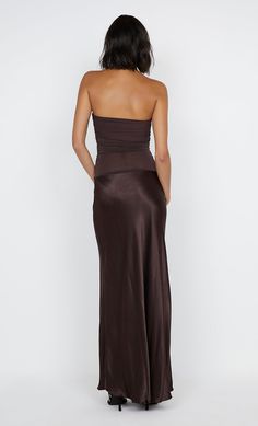 The BEC + BRIDGE Dua Strapless Dress is an effortless yet elegant strapless maxi dress. Featuring a soft mesh bodice, that is lined at the bust and detailed by a sheer midsection. Soft gathers at the side seams enhance the silhouette, before falling into a slinky bias cut skirt at the low waist. Styled with BEC + BRIDGE Kate Heel.