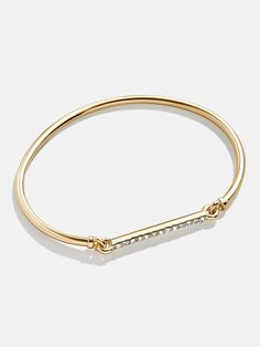 Everyone needs a classic cuff in their jewelry box. Our Holly Cuff is a gold wrist layer accented with pavé stones on the clasp that give this piece a utility-inspired look. We recommend pairing this style with a few of our best-selling Pisa bracelets. Bauble Bar Jewelry, Bauble Bar, Sparkly Bracelets, Stone Jewellery, Bar Jewelry, Gold Bracelet Cuff, Gold Cuffs, Jewelry Inspo, Gem Stone