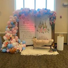 a decorated stage set up with balloons, flowers and a bench in front of it