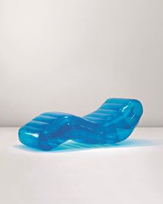 an inflatable blue object sitting on top of a white table