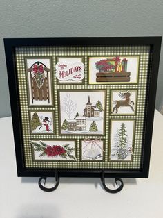 a black frame with christmas pictures on it