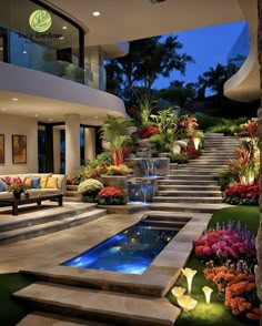 an outdoor living area with stairs, flowers and water feature in the center surrounded by greenery