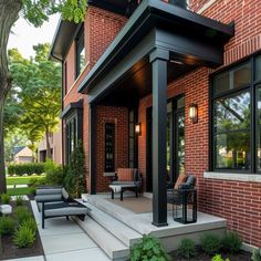 Beautify Your Red Brick Home with These Front Porch Concepts • 333+ Images • [ArtFacade] Red Brick Homes With Black Trim, Black Trim Red Brick House, Red Brick House Entrance, Garage Door With Red Brick House, Modernizing Red Brick Exterior, Red Brick Stone House Exterior, Front Porch Ideas Red Brick House, Red Brick Modern Farmhouse Exterior, Modernize Red Brick Exterior