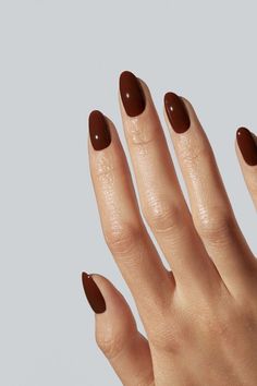 Just like the drink, we couldn't live without it. Due to popular demand, this color is back in stock for a limited time only. A dark reddish-brown color inspired by Ethiopian Arabica coffee beans. For those comparing to our other browns, Coffee is lighter than Espresso and much redder than Girl Scout. Coffee Bean Nail Color, Brown Coffee Nails, Cool Toned Nail Colors, Coffee Bean Nails, Brown Nail Aesthetic, Brown Oval Nails, Reddish Brown Nails, Coffee Brown Nails, Simple Brown Nails