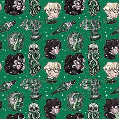 a green and black pattern with many different faces