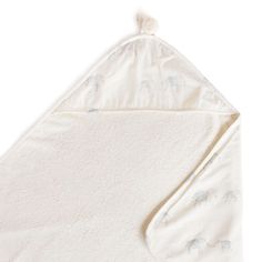 a white blanket with an elephant design on the front and back, folded up to show it's inner corner