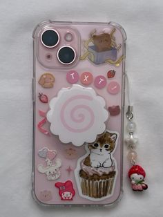 a pink phone case with an image of a cat and cupcake on the back