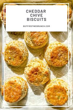 cheddar chive biscuits in a baking pan with text overlay that reads cheddar chive biscuits