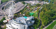 an aerial view of a ferris wheel in the city