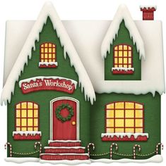 a green christmas house with snow on the roof and windows decorated in red, white and green