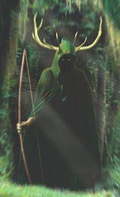 an image of a man with a bow and arrow in the woods holding a deer's head