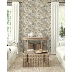 a living room scene with focus on the coffee table and wall papered walls in the background