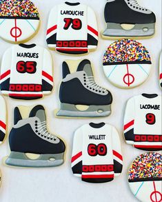 decorated cookies in the shape of ice skates and hockey jerseys with sprinkles