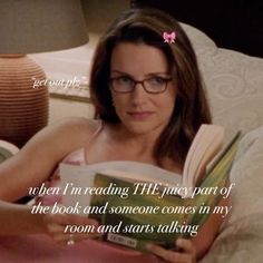 a woman laying in bed reading a book with a quote from the tv show friends