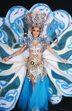 a woman in a blue and white costume