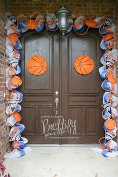 a door decorated with basketballs and streamers