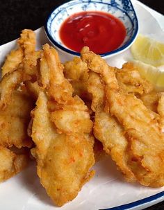 fried food on a plate with dipping sauce