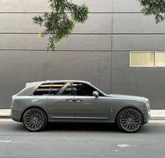 a silver car parked on the side of the road