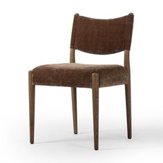 a wooden chair with a brown upholstered seat and back, viewed from the side