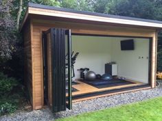 an outdoor gym with exercise mats and equipment