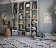 a living room filled with lots of furniture and decor on top of a white rug