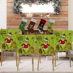 the grinch christmas stockings are sitting on chairs